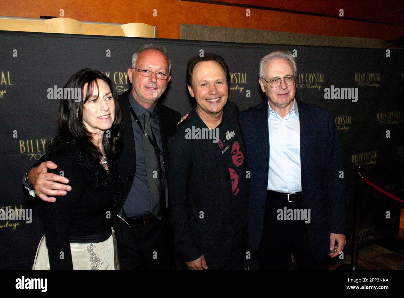 Billy Crystal and his wife with guests at the after-party of his “700 ...