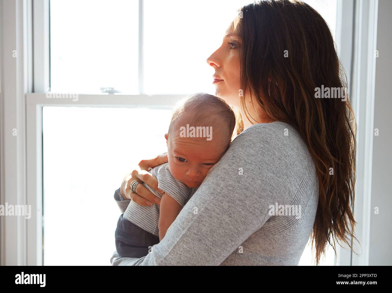 The light of her life. a mother holding her newborn baby Stock Photo ...