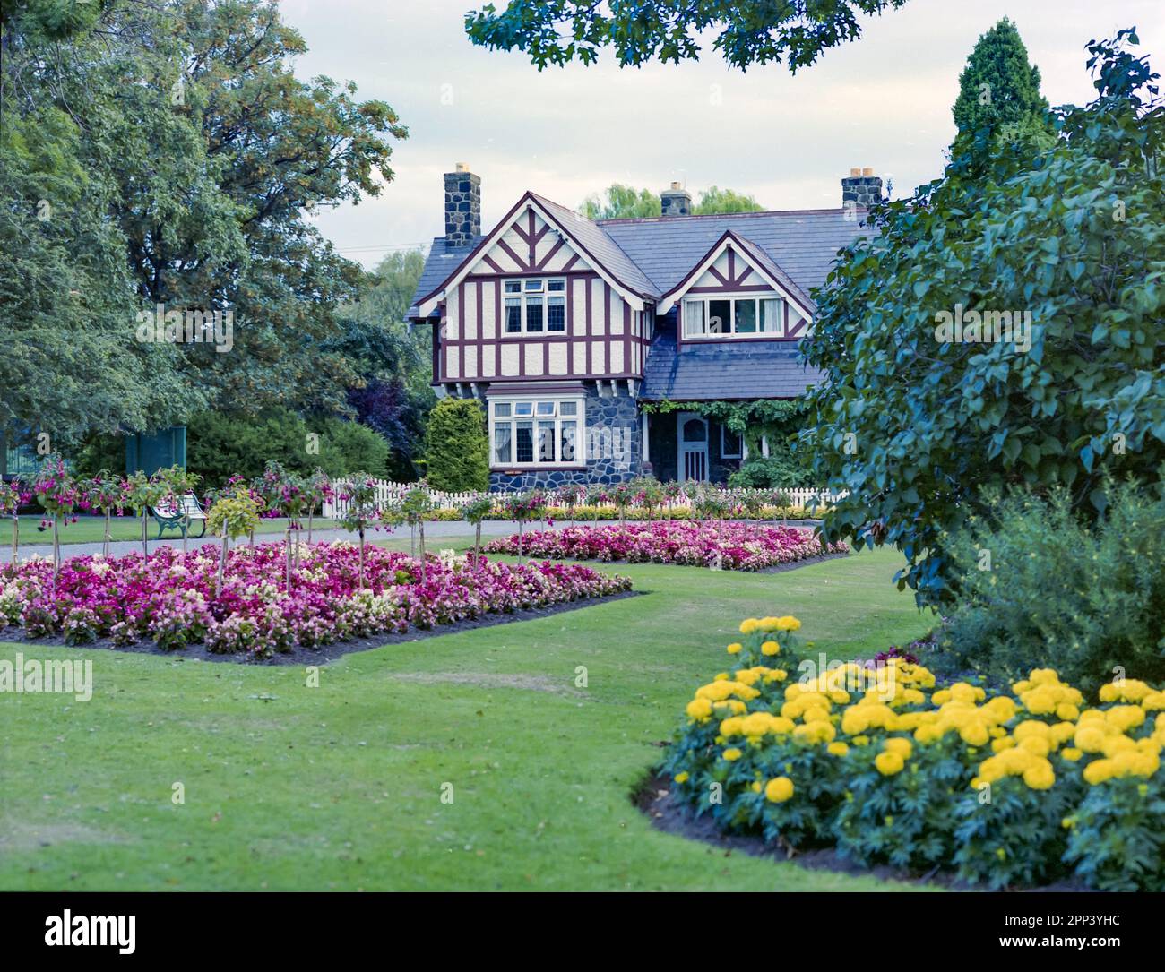 A 1981 historic image of the Curators Cottage in the Christchurch Botanic Gardens in the city of the same name on the south island of New Zealand. The cottage was built in 1920 and in the same year this shot was taken the building was registered as a heritage building by the New Zealand Historic Places Trust Stock Photo