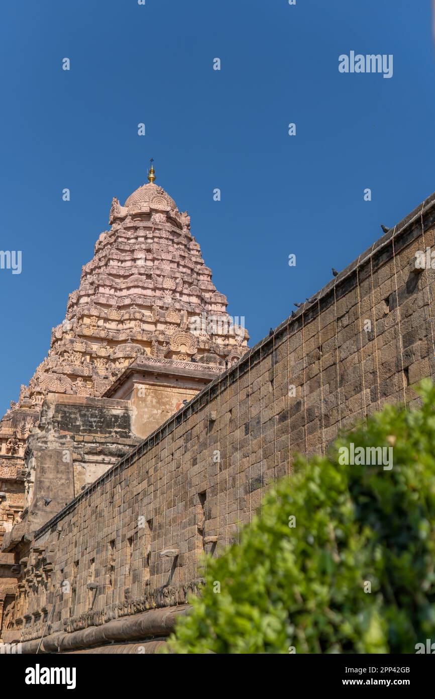 With a backdrop of a clear sky, the siva lingam is housed at the Gangaikonda Cholapuram temple vimanam. Stock Photo