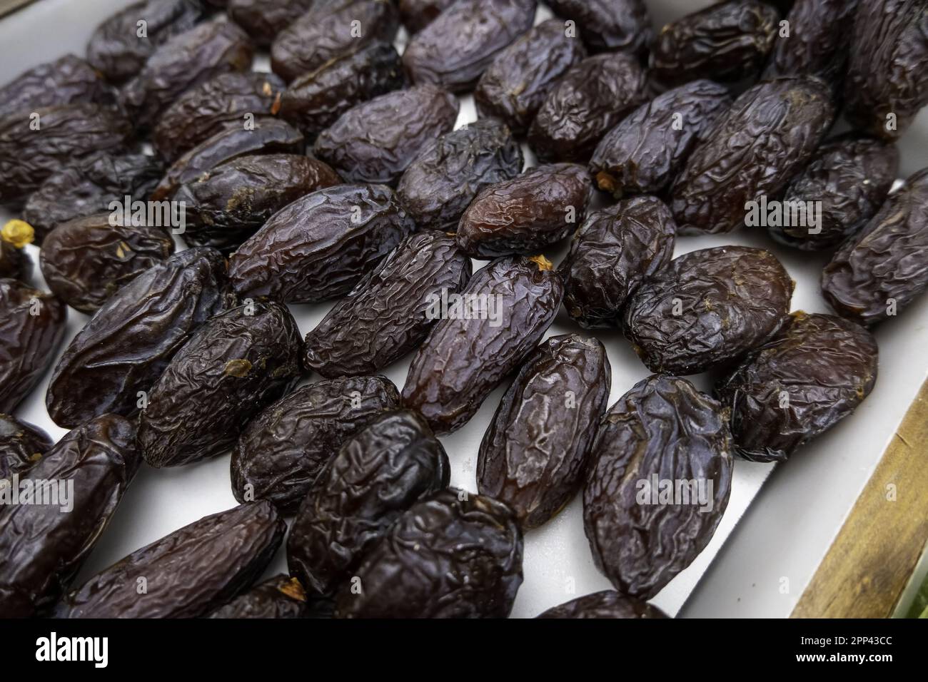 Detail of sweet dried dates in a market, fruit and healthy food Stock