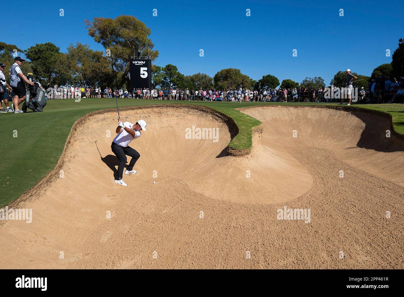 Danny Lee of Iron Heads GC hits his shot from a bunker on the fifth