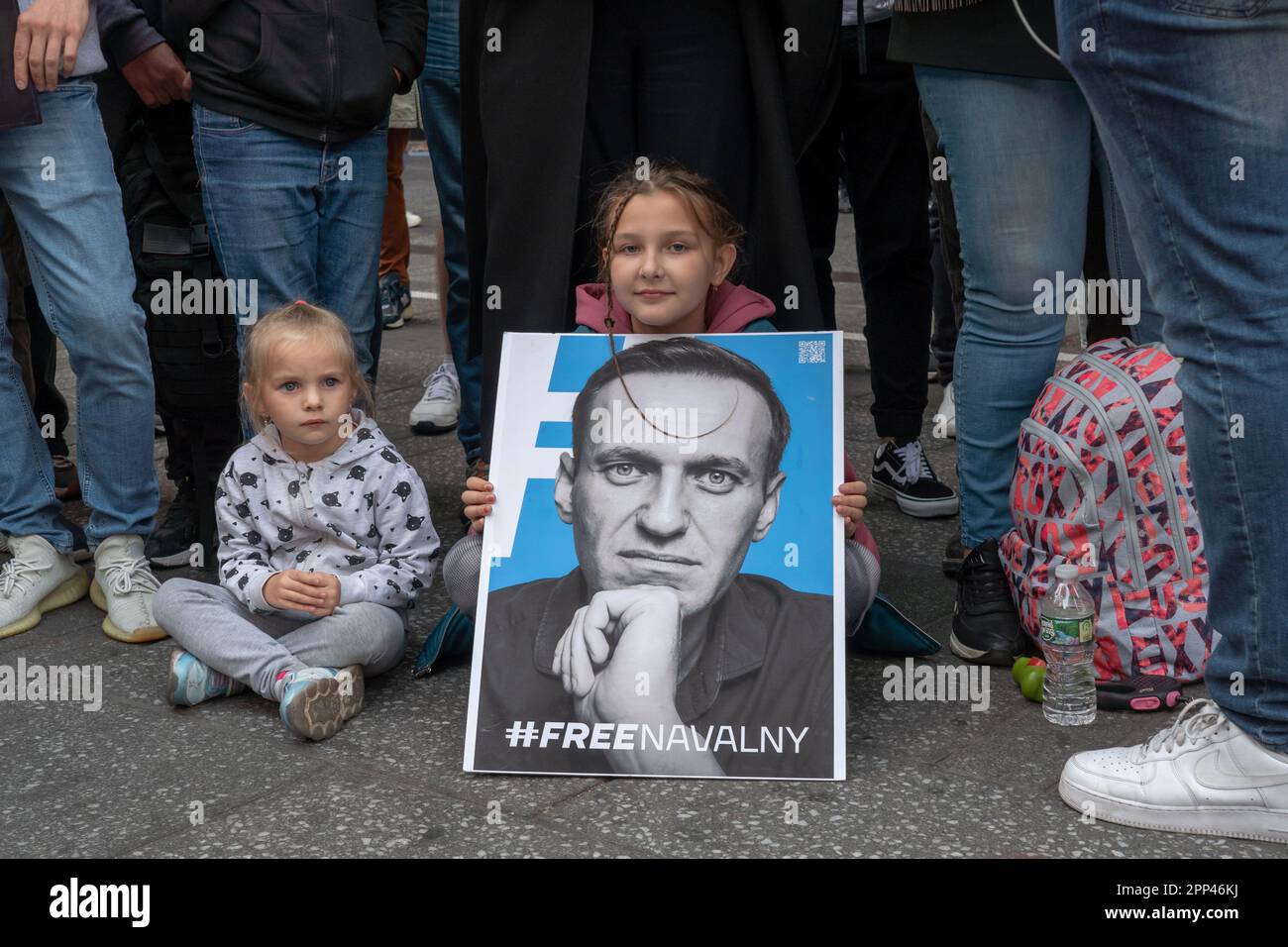 New York, United States. 21st Apr, 2023. Children are seen with a poster of Alexei Navalny during a demonstration for the freedom of Alexei Navalny in New York. Protesters take to Times Square to demonstrate were Russians speaking activists voice outrage over Vladimir Putin's rule and the jailing of Russian opposition leader Alexei Navalny saying that Right now, Alexei is once again in mortal danger in New York City. Credit: SOPA Images Limited/Alamy Live News Stock Photo