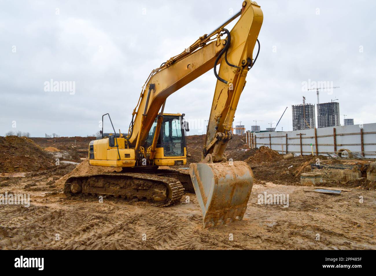 Big bright yellow powerful industrial heavy excavator tractor