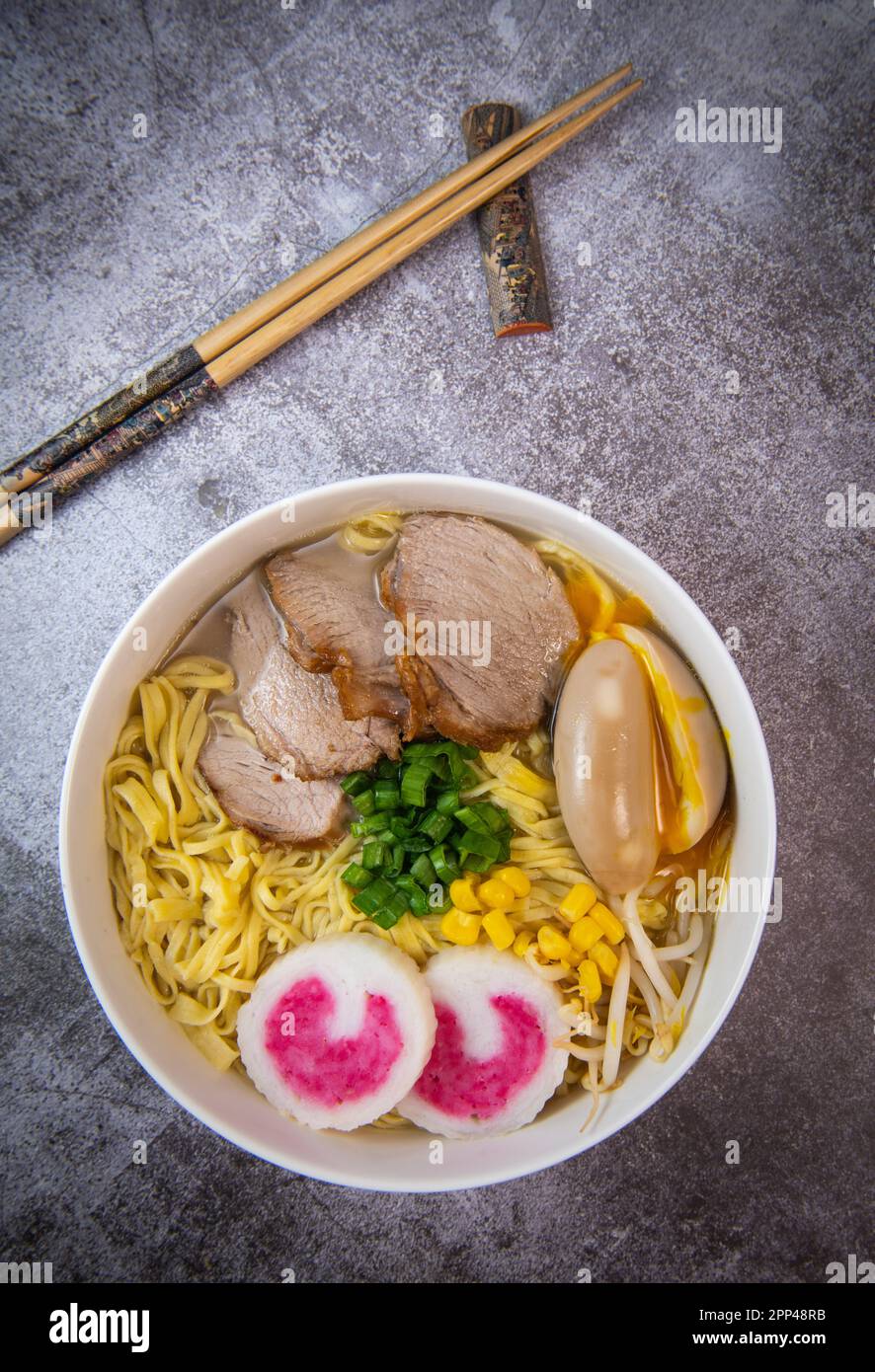 Fresh ramen noodles with garnish, pork tenderloin, eggs marinated in