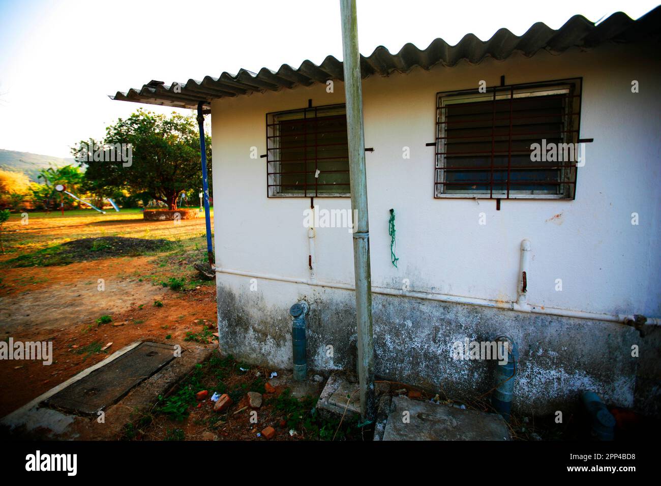 Dirty cement walls of a house in a village in India. Stock Photo