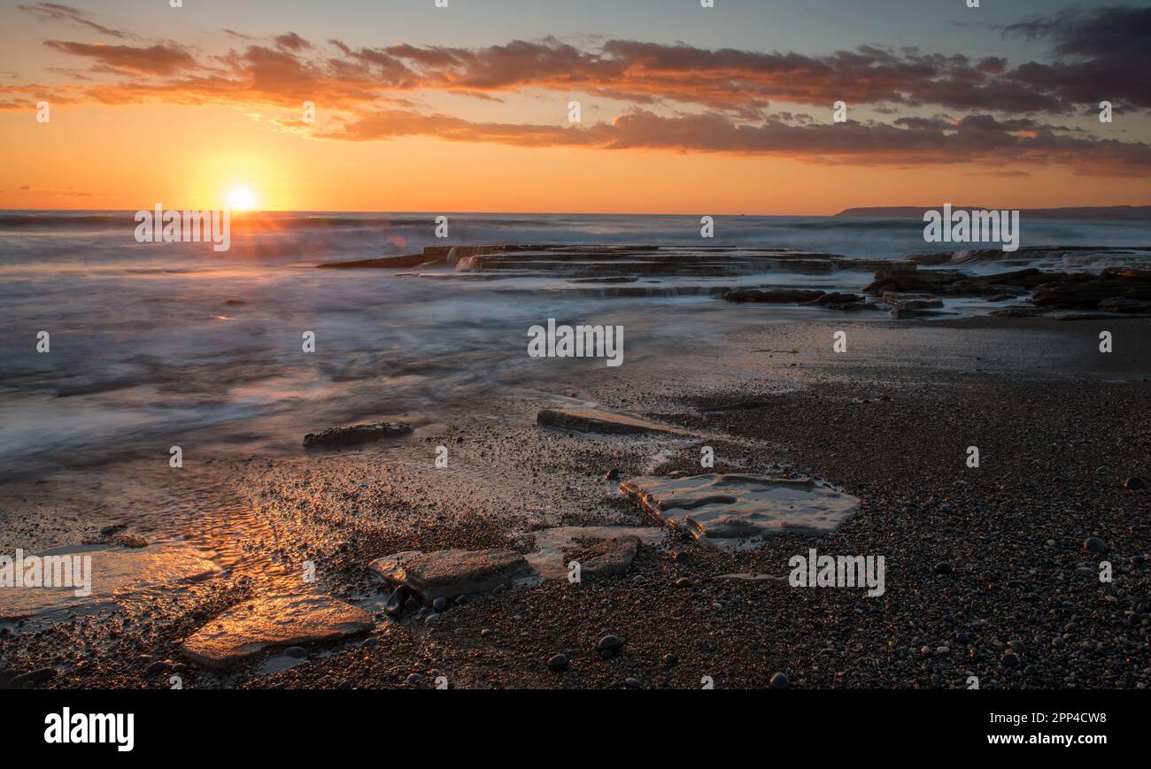 Dramatic beautiful sunset on a rocky coast at Akrotiri area in Limassol, Cyprus. End of day Stock Photo