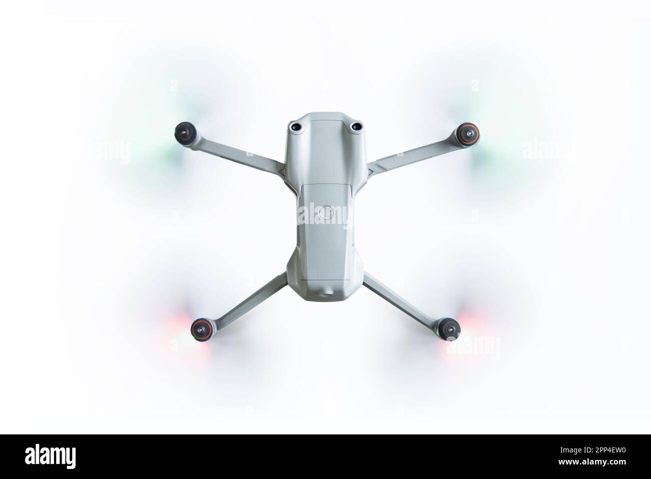 flying drone with spinning propellers on a white background top view