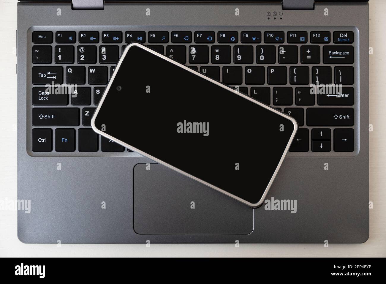 Open laptop with black screen smartphone. top view, copy space Stock Photo