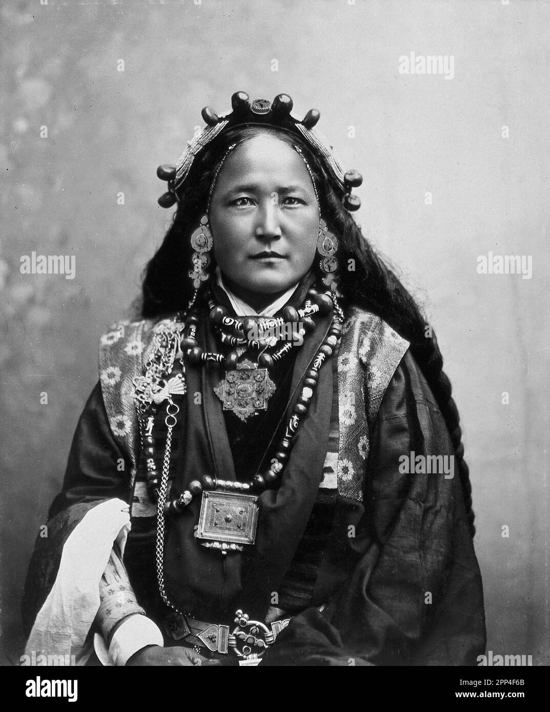 Ani Chokyi, a Sikkimese/Tibetan woman resident in Darjeeling, wearing elaborate jewellery, costume and head-piece.  Photograph by Thomas Paar, ca. 189 Stock Photo