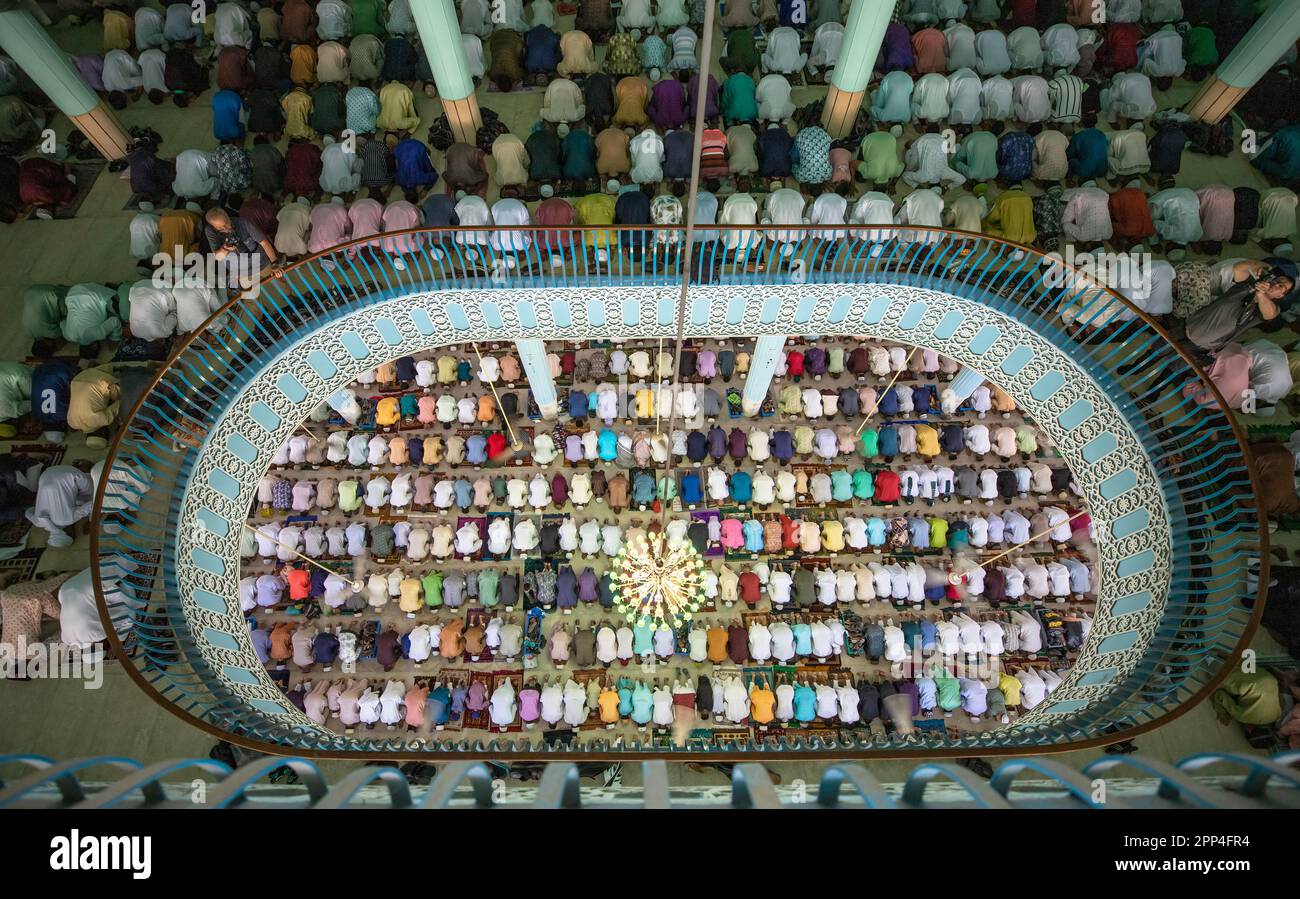 Muslim take part in the Eid-ul-Fitr prayers at Baitul Mokarram National Mosque in Dhaka, Bangladesh. Stock Photo