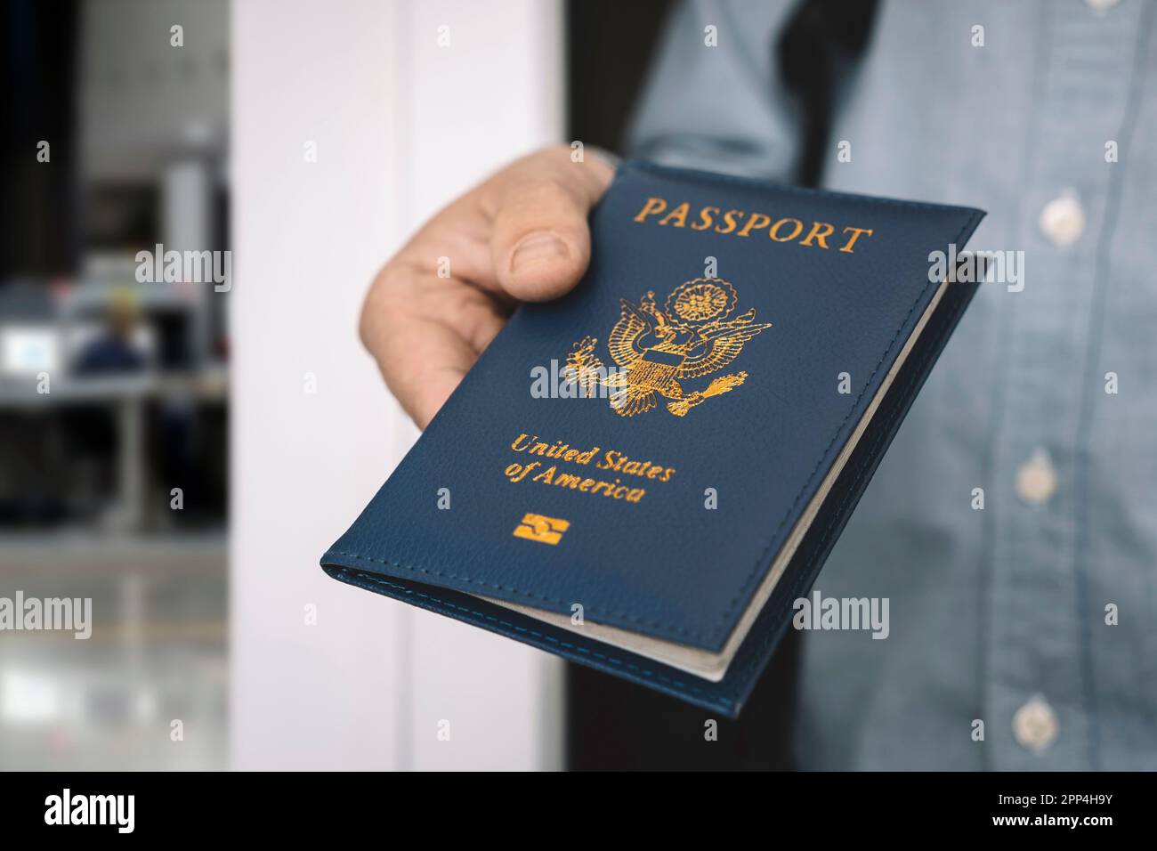 hand holding passport with bokeh background, jorney and travel concept. Passport check at the border. A man will find a passport for obtaining a visa Stock Photo