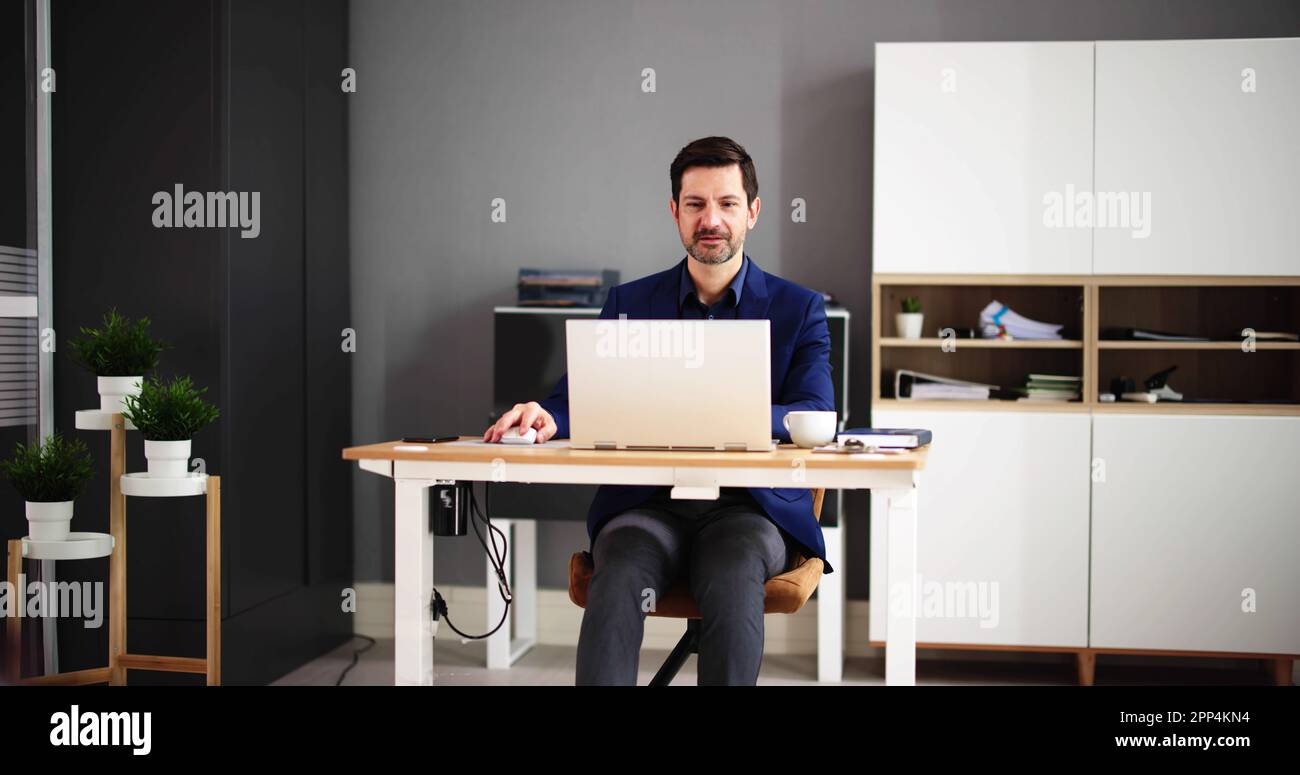 Happy Professional Man Employee Using Computer For Work Stock Photo - Alamy