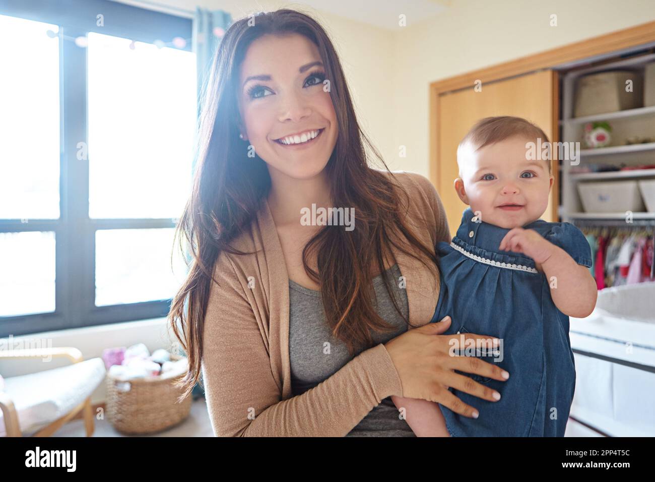 Shes my little baby angel. a mother with her baby girl at home. Stock Photo
