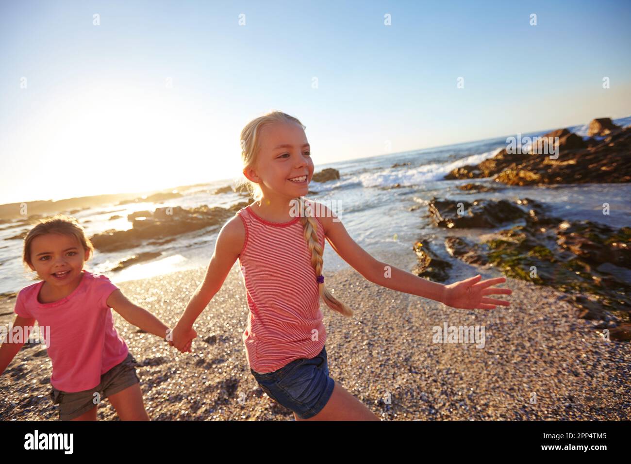 You can never have too much beach. two little girls having fun on the