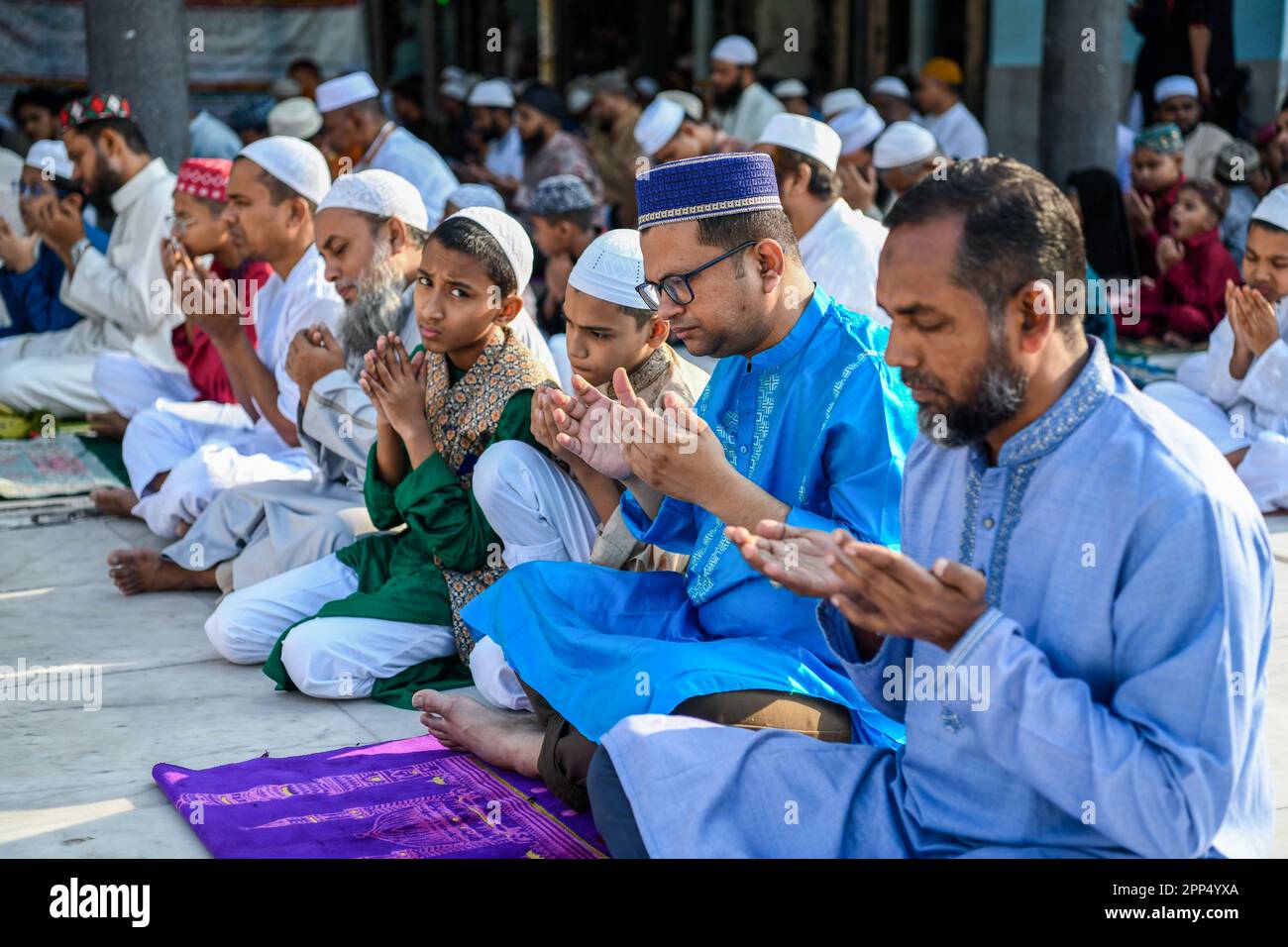 Muslims offer prayers on the first day of Eid alFitr, which marks the
