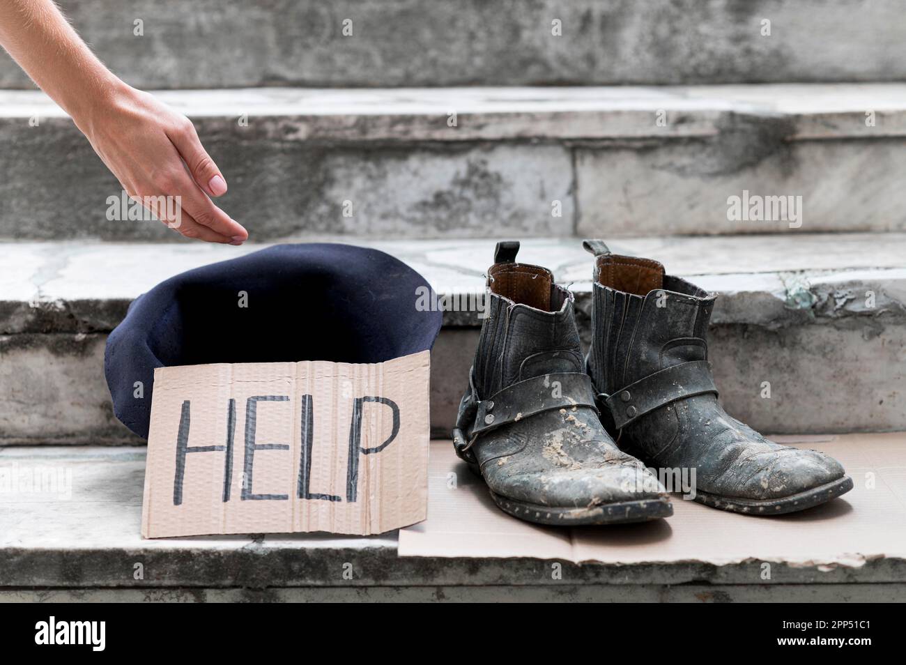 Homeless person begging help Stock Photo