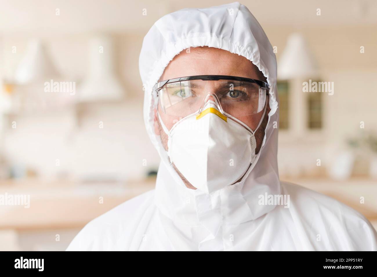 Front view man wearing hazmat suit Stock Photo Alamy