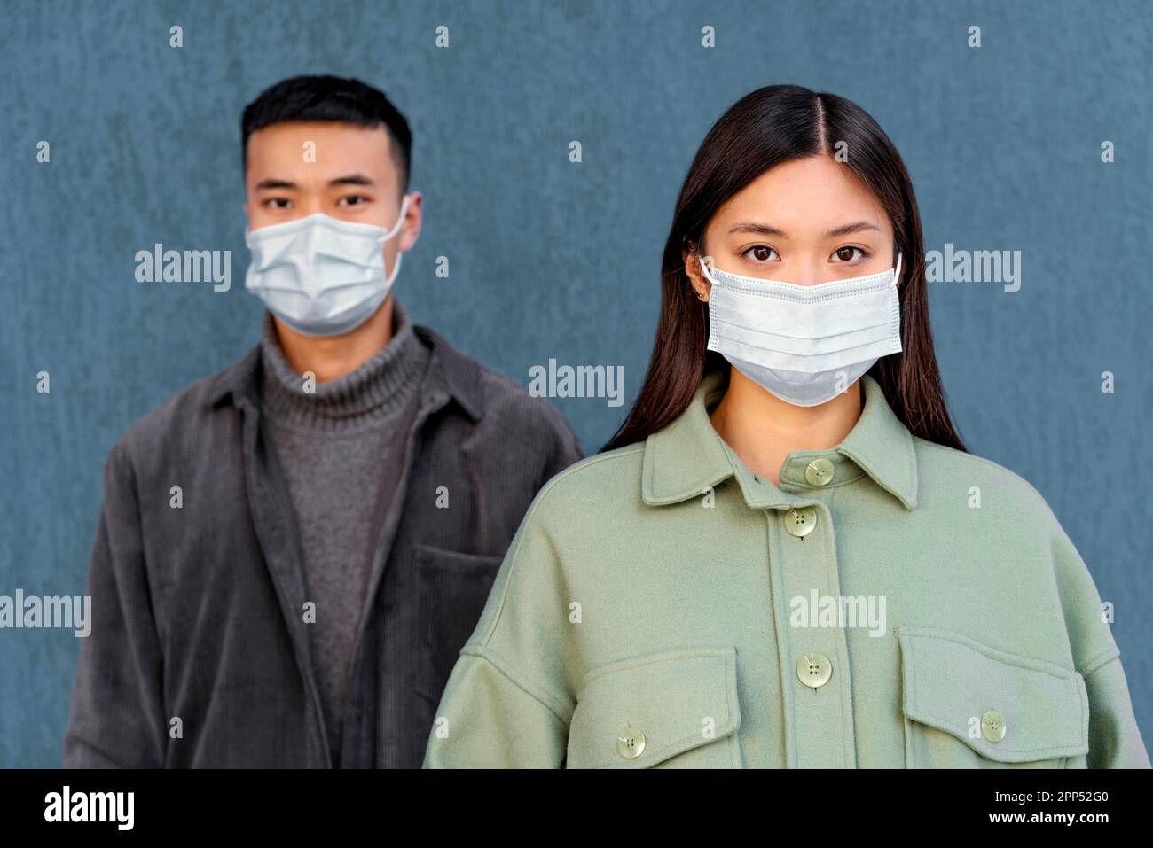 Young japanese couple wearing mask Stock Photo