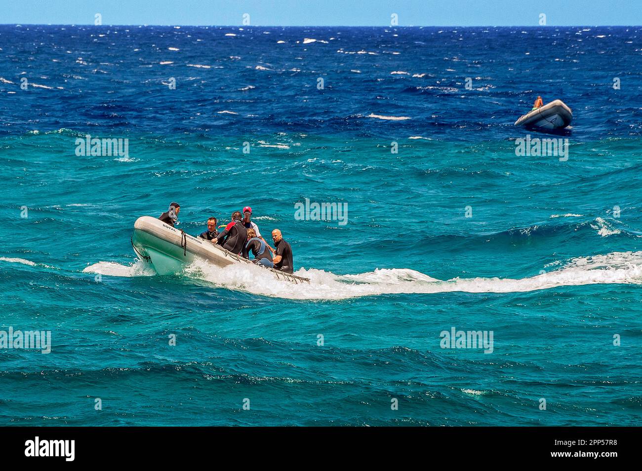 Rubber dinghies with divers in turquoise and blue water on Sanganeb Reef, National Park near Port Sudan, Unesco World Heritage Site, Sudan Stock Photo