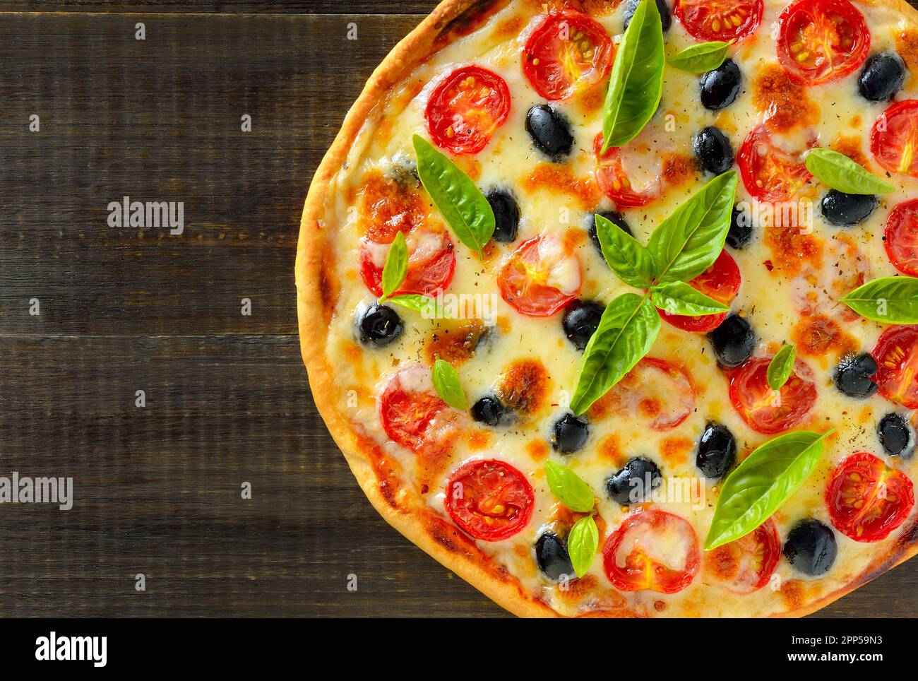 Homemade pizza with tomato and olives. Top view, flat lay Stock Photo