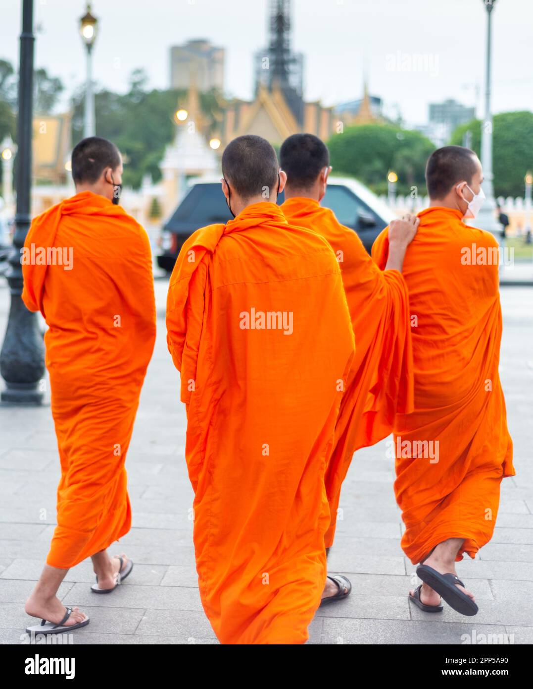 Phnom Penh,Cambodia-January 4th 2023: Monks of all ages from the nearby temples, mingle with the rest of the capital city's population,who come here i Stock Photo