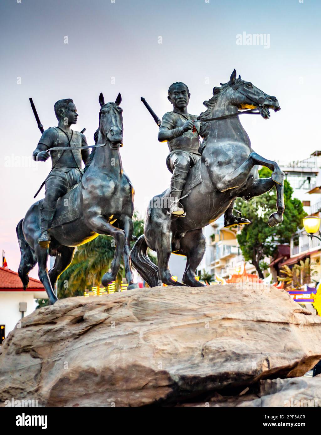 Phnom Penh,Cambodia-January 4th 2023:Mounted on a large rock,along the Riverside walk.A depiction of two heroic,historic Khmer warriors,on horseback r Stock Photo