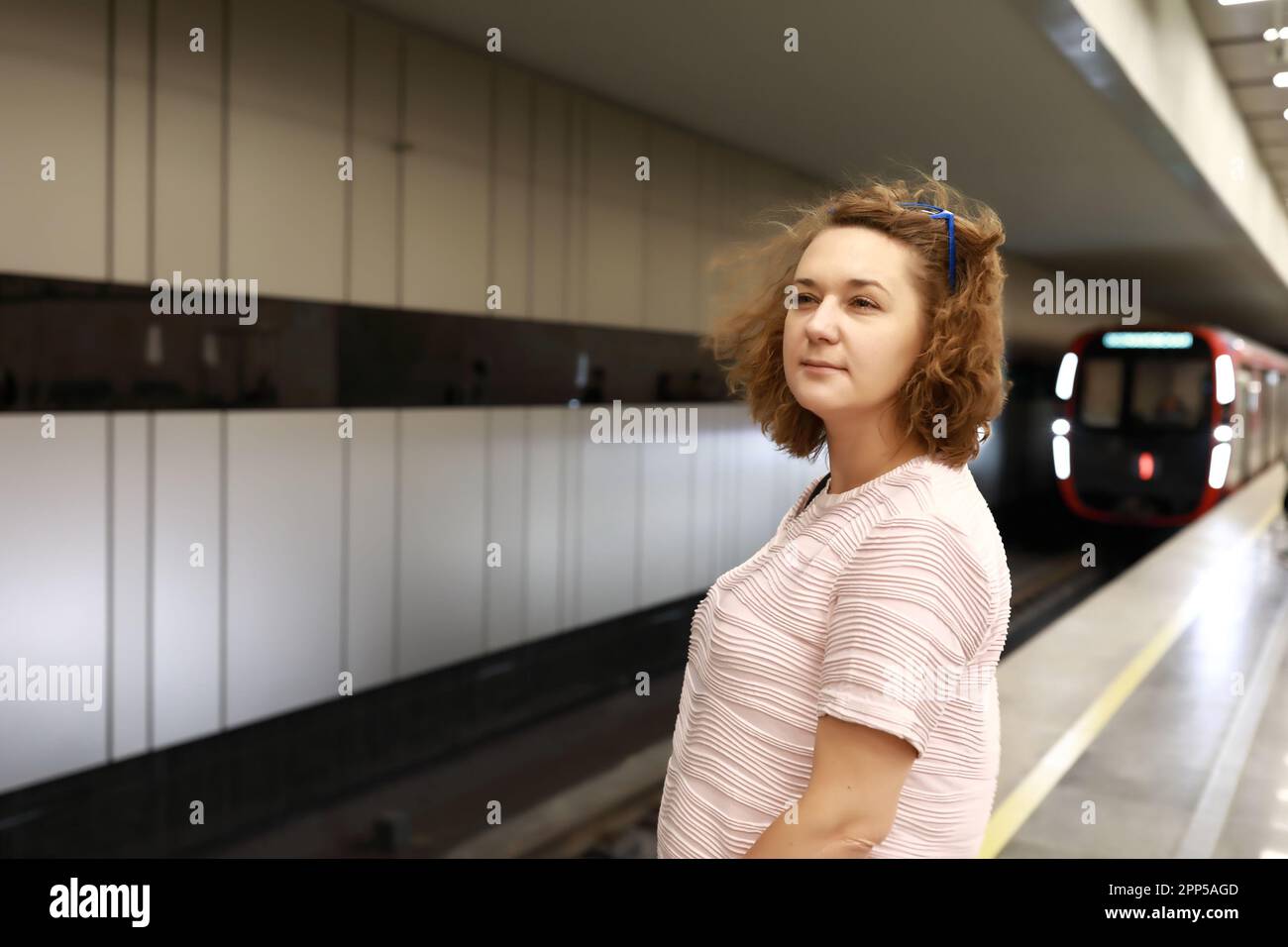 Indoor portrait woman on subway hi-res stock photography and images - Alamy