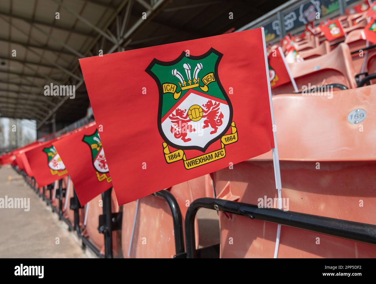 Wrexham, Wrexham County Borough, Wales. 22nd April 2023. Flags laid out ahead of kick off on the home end seats for the Wrexham fans, during Wrexham Association Football Club V Boreham Wood Football Club at The Racecourse Ground, in in the Vanarama National League. (Credit Image: ©Cody Froggatt/Alamy Live News) Stock Photo