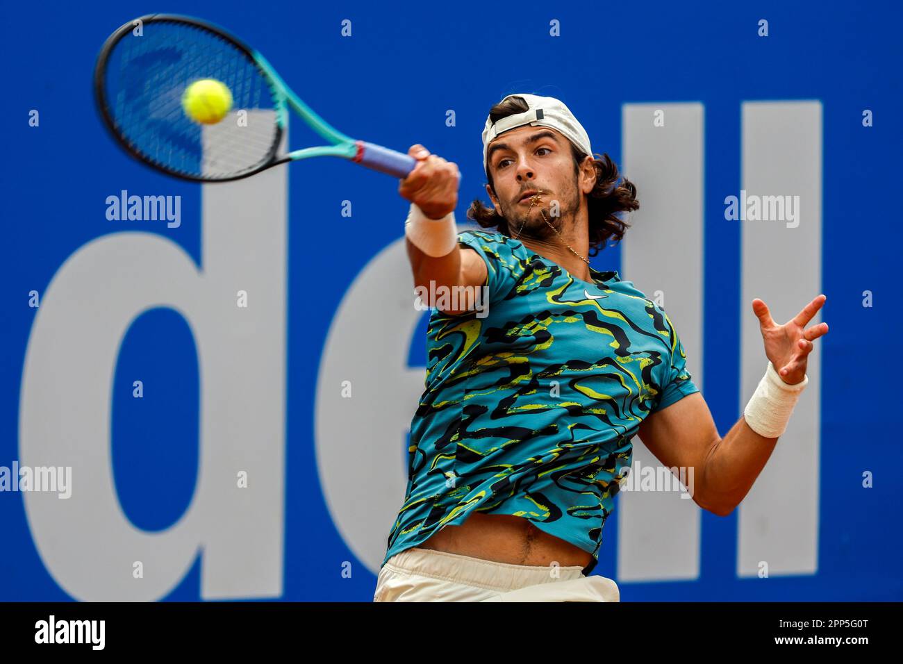 Lorenzo Musetti, of Italy, returns the ball to Stefanos Tsitsipas, of Greece, during a semi final open tennis tournament, in Barcelona, Spain, Saturday, April 22, 2023