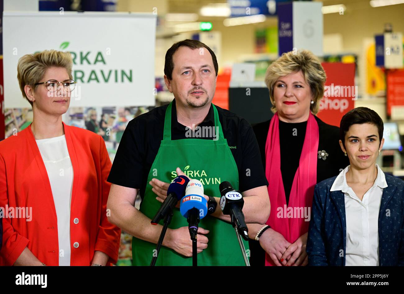 (L-R) Tesco CR CEO Katarina Navratilova, Czech Federation of Food Banks chairman Ales Slavicek, members of Czech parliament Vera Kolarova and Olga Richterova during the press conference on the occasion of the food collection in the Tesco supermarket, Prague, Czech Republic, April 22, 2023. A record number of 1,540 shops across the Czech Republic took part in the food collection. Compared to previous years, this is hundreds more, and more volunteers are joining the collection. The collected food will go via food banks to single mothers, lonely seniors, handicapped people and other people in nee Stock Photo