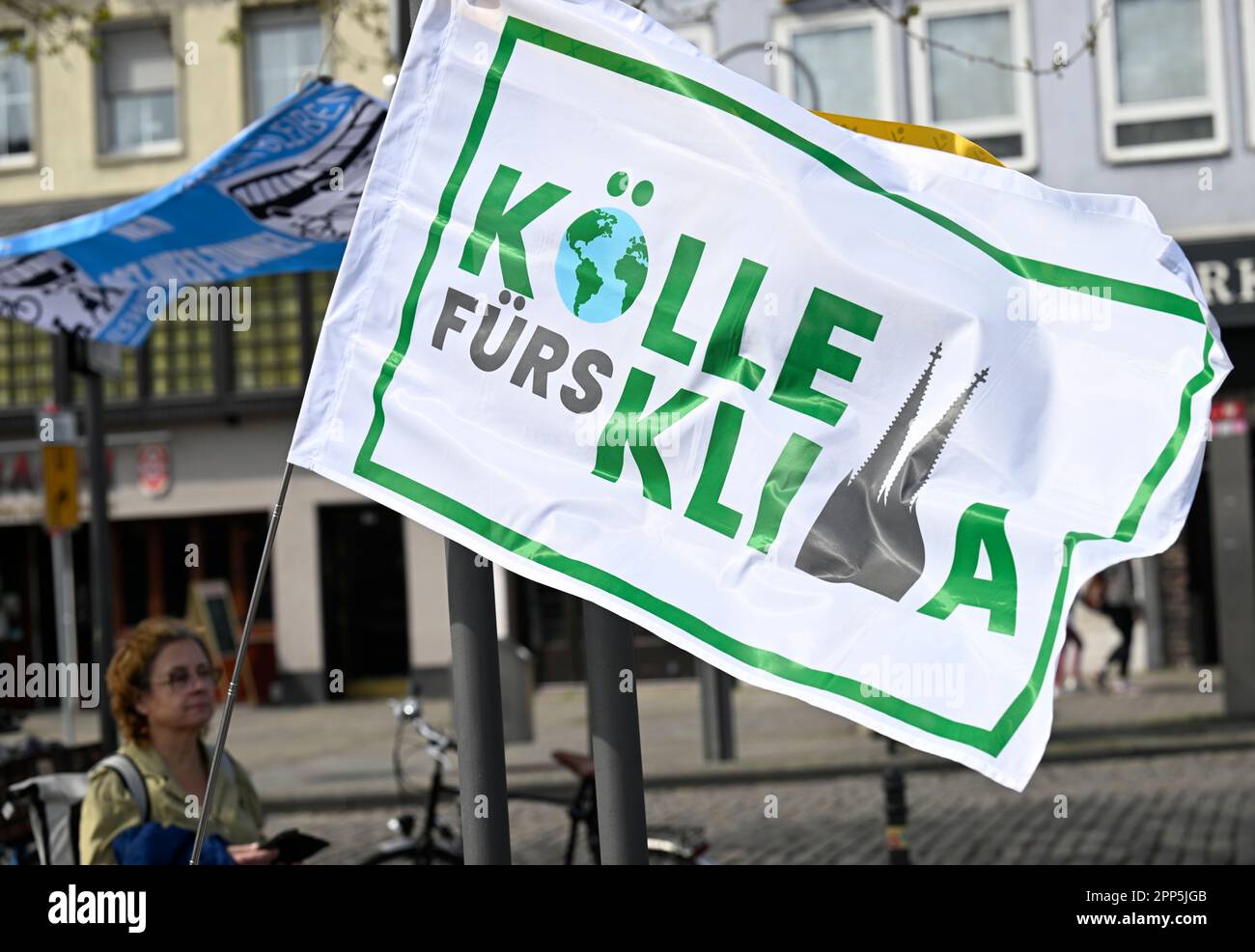 Cologne, Germany. 22nd Apr, 2023. A flag supports environmental initiatives calling for nationwide days of action today under the slogan 'Mobility turnaround now!'. Here in Cologne against the expansion of the A4. Credit: Roberto Pfeil/dpa/Alamy Live News Stock Photo