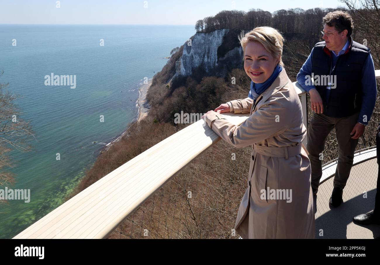 22 April 2023, Mecklenburg-Western Pomerania, Sassnitz: During the opening tour for the skywalk over the chalk cliffs of the Baltic Sea island of Rügen, Manuela Schwesig (SPD), Minister President of Mecklenburg-Western Pomerania, looks out over the Baltic Sea, with Reinhard Meyer (SPD), Minister of Economics of Mecklenburg-Western Pomerania, standing behind her. The so-called Königsweg is held by a huge guyed mast and hovers above the 118-high Königsstuhl, Germany's largest chalk cliff. Photo: Bernd Wüstneck/dpa Stock Photo