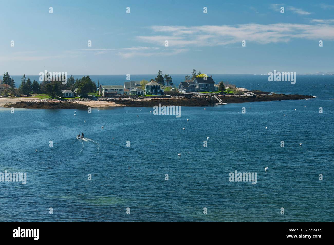 An aerial view of the pemaquid river and vacation homes on a bay in New