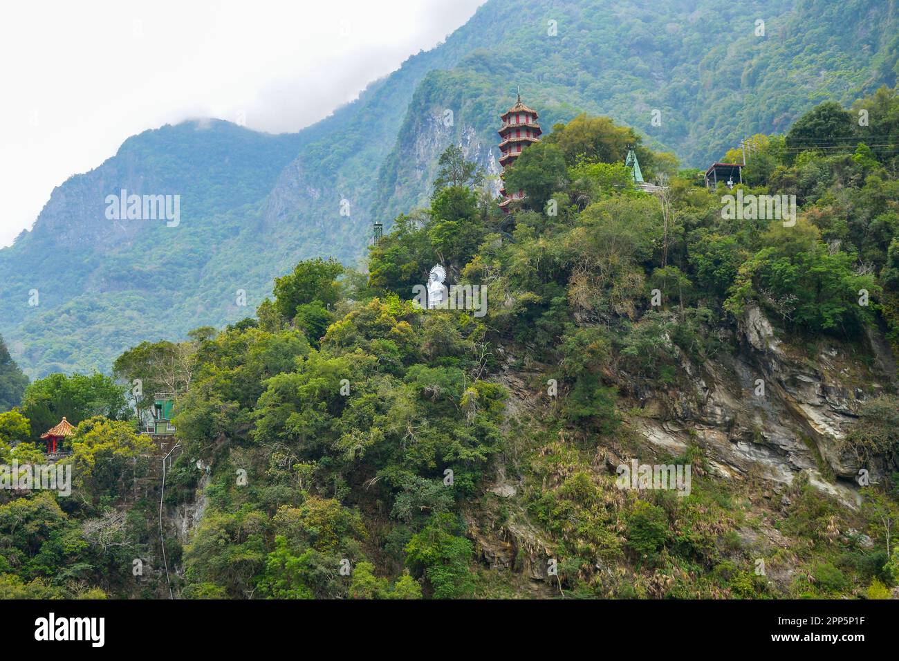 Chinese pagoda and Buddha statue at the top of mountain in Taroko National Park gorge in Hualien, Xiulin Township, Taiwan Stock Photo