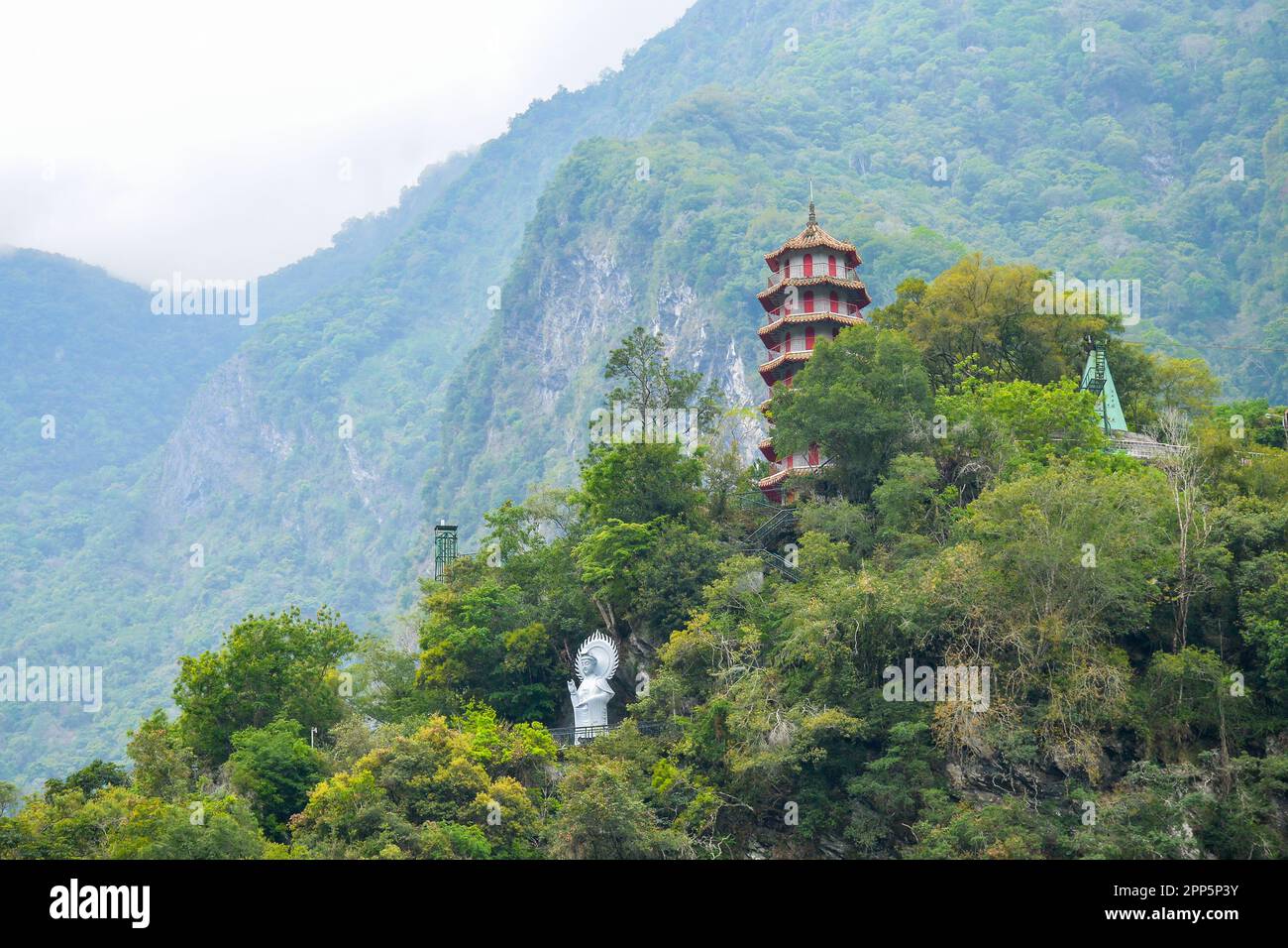 Chinese pagoda and Buddha statue at the top of mountain in Taroko National Park gorge in Hualien, Xiulin Township, Taiwan Stock Photo