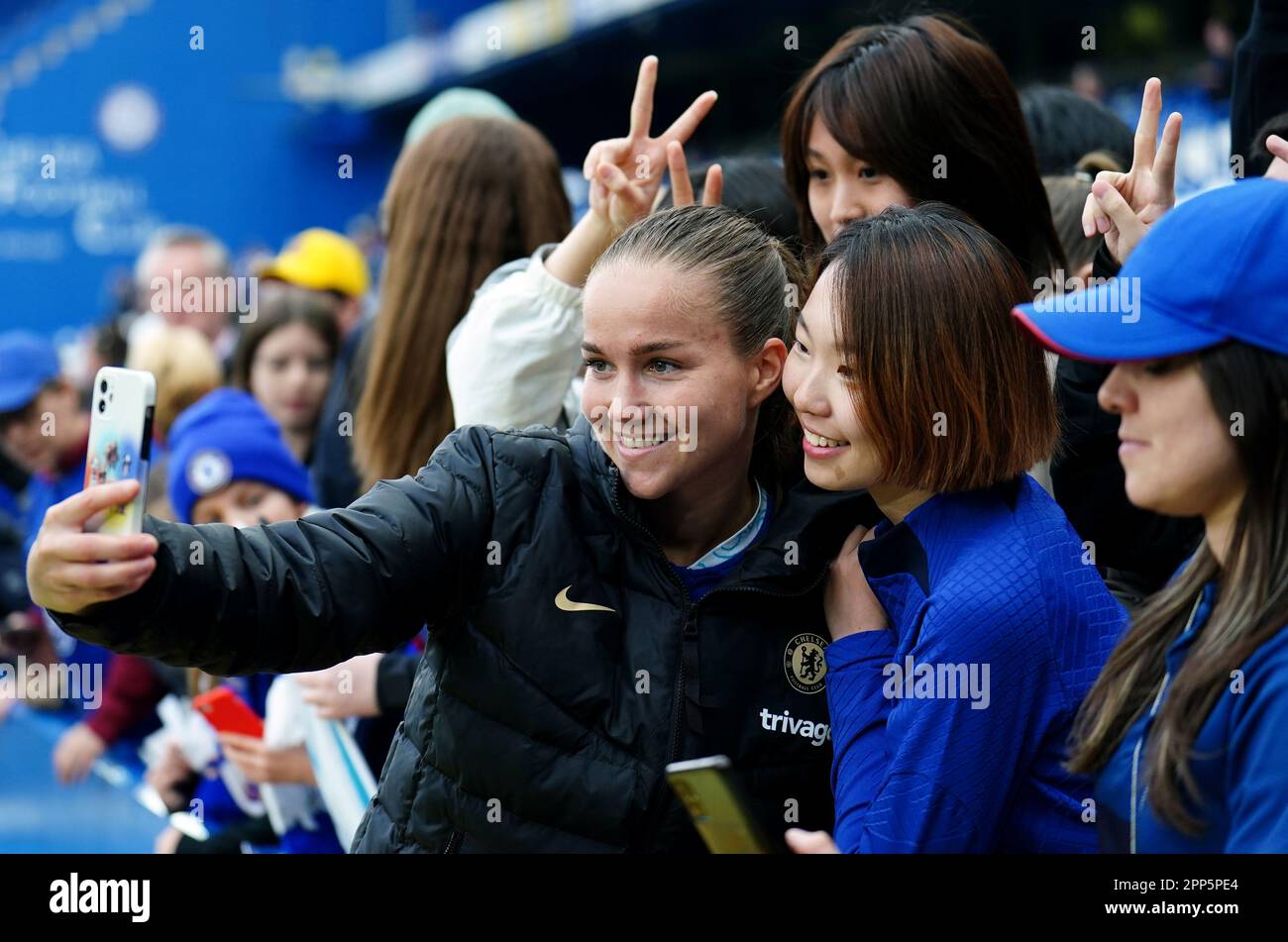 Chelsea's Guro Reiten takes a selfie with a fan following the UEFA Women's Champions League semi
