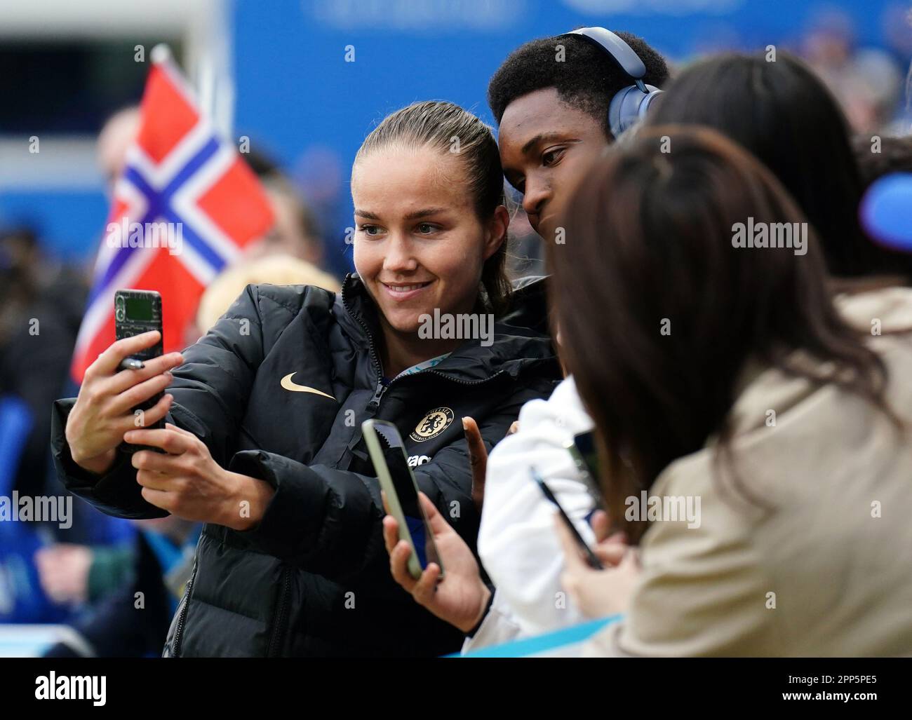 Chelsea's Guro Reiten takes a selfie with a fan following the UEFA
