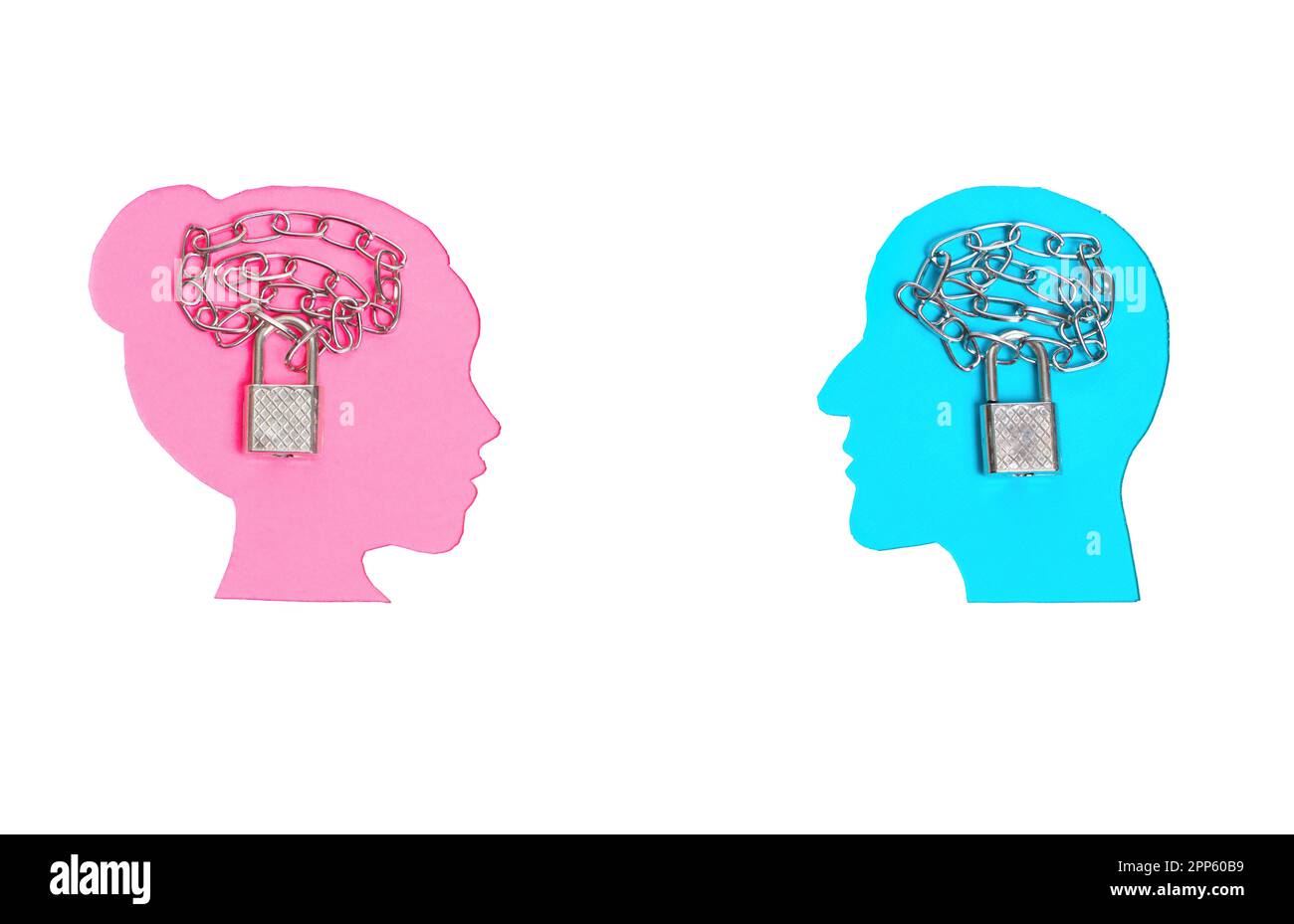 Pink and blue female and male head profile paper cutouts on white with chained padlocks symbolically placed inside the brain area of each face. Stock Photo