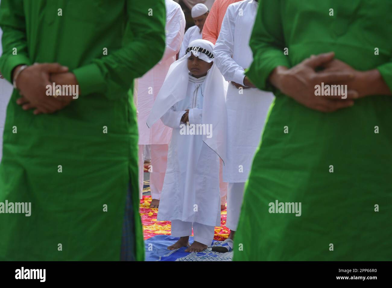 A Muslim Boy Specially Dressed Offers A Special Prayers On The Occasion a-muslim-boy-specially-dressed-offers-a-special-prayers-on-the-occasion