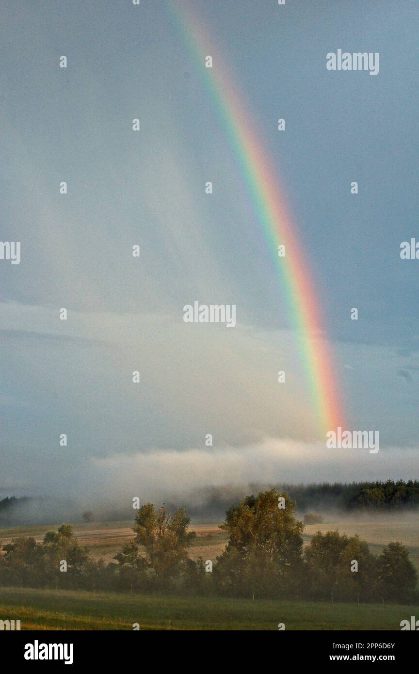 Rainbow over Fog. Stock Photo