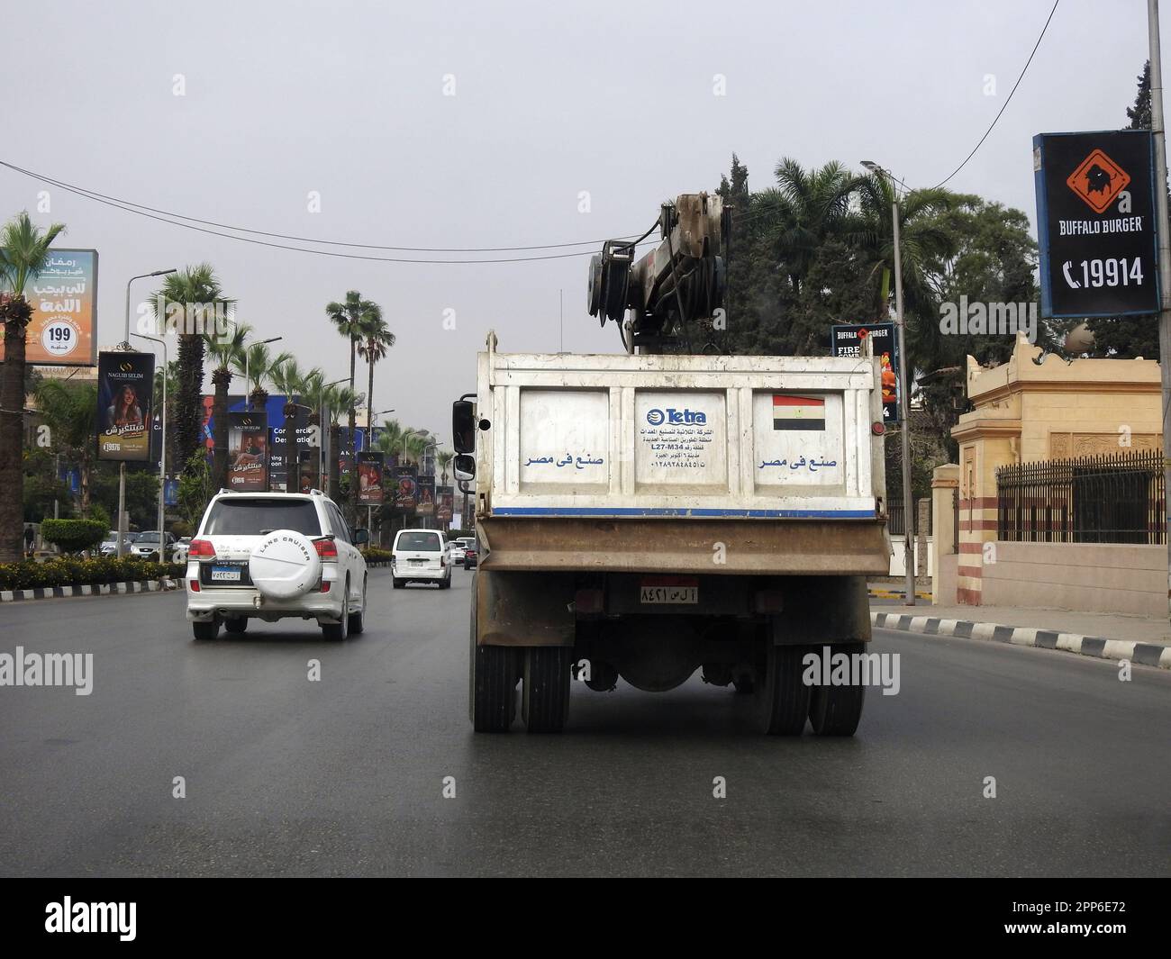 Cairo, Egypt, April 8 2023: Maintenance lift truck with a lifting mechanical equipped crane with a cable for lifting heavy objects Tetra transport tru Stock Photo