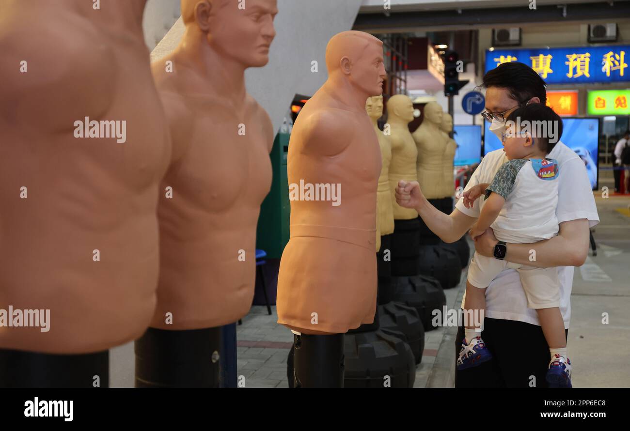 A man hits a Boxing dummy during Open day of Hong Kong Police College in Wong Chuk Hang.  18APR23 SCMP / Edmond So Stock Photo