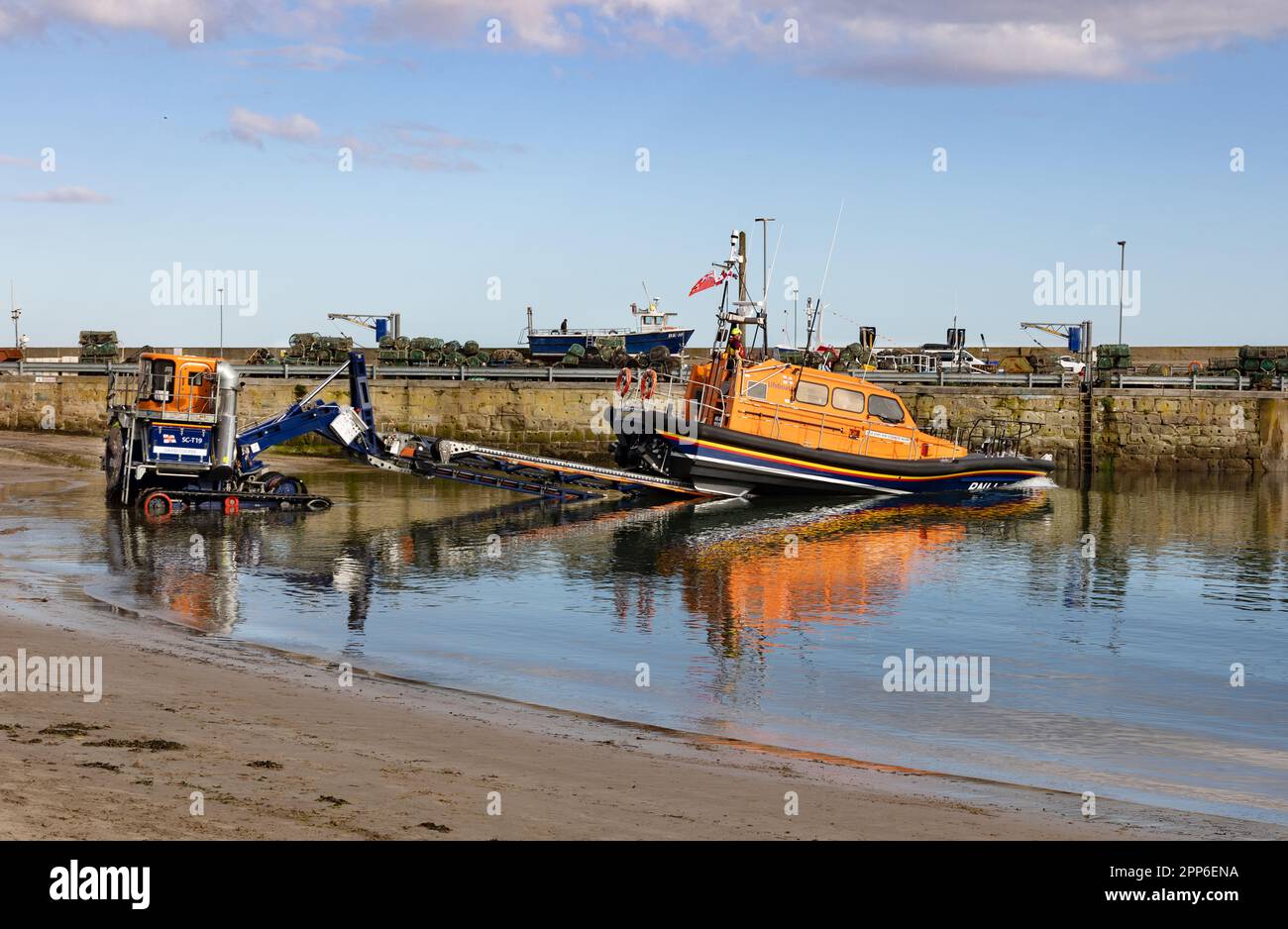 RNLI lifeboat launch from a lifeboat launcher, Seahouses harbour, Seahouses Northumberland UK Stock Photo