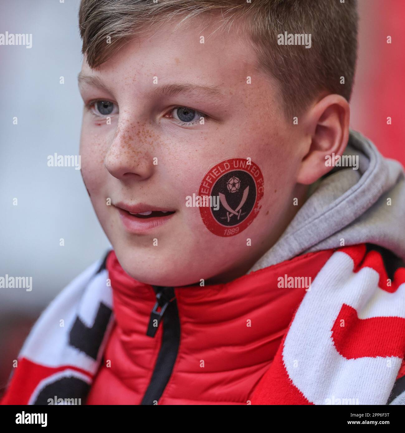 London, UK. 22nd Apr, 2023. A young fan with a painted Sheffield United logo their cheek during the Emirates FA Cup Semi-Final match Manchester City vs Sheffield United at Wembley Stadium, London, United Kingdom, 22nd April 2023 (Photo by Mark Cosgrove/News Images) in London, United Kingdom on 4/22/2023. (Photo by Mark Cosgrove/News Images/Sipa USA) Credit: Sipa USA/Alamy Live News Stock Photo