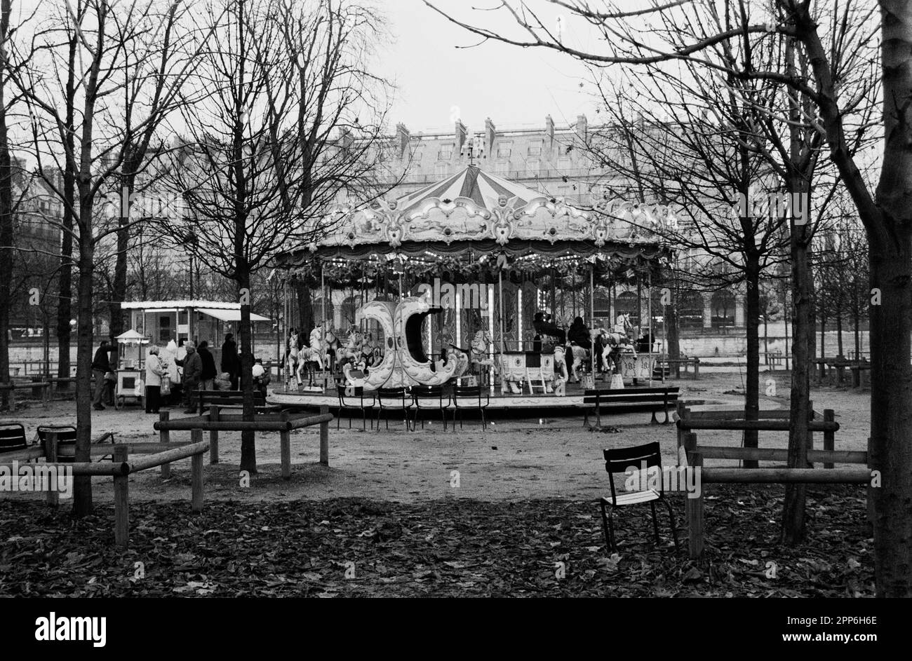 CHILDREN CAROUSEL IN THE JARDIN DES TUILERIES - PARIS FRANCE DURING WINTER SEASON - SILVER FILM © photography : Frederic BEAUMONT Stock Photo
