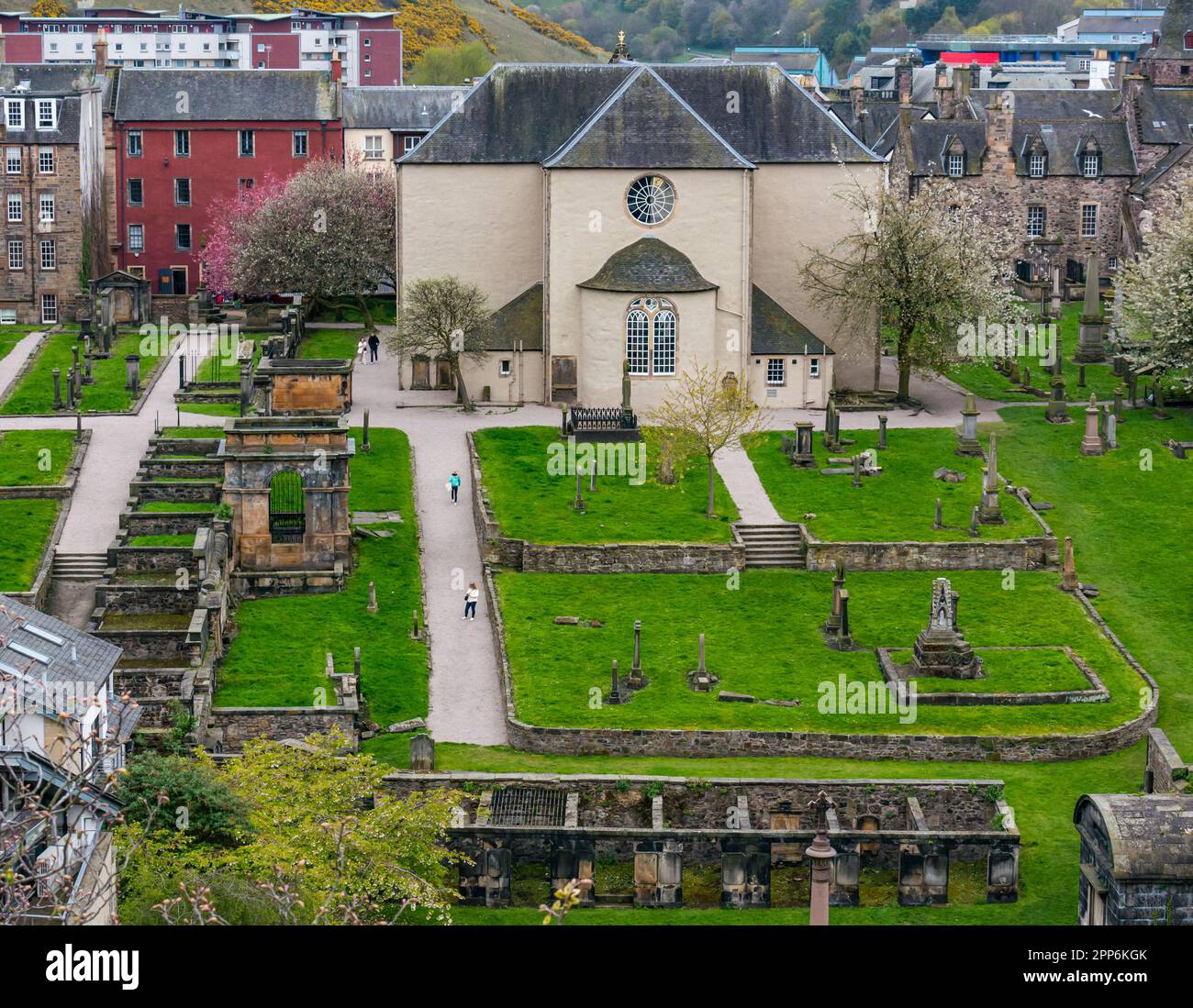 View of rear exterior of Canongate Church and graveyard with old graves, Royal Mile, Edinburgh, Scotland, UK Stock Photo