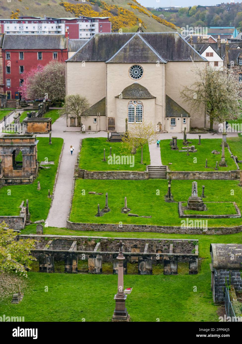 View of rear exterior of Canongate Church and graveyard with old graves