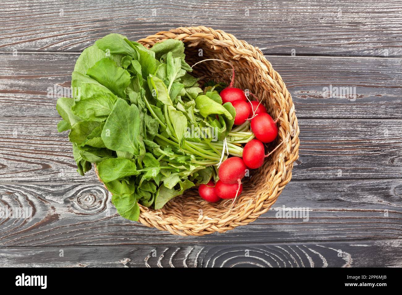 radish basket on wood background Stock Photo