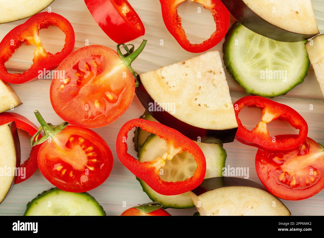 sliced vegetables on wood background Stock Photo